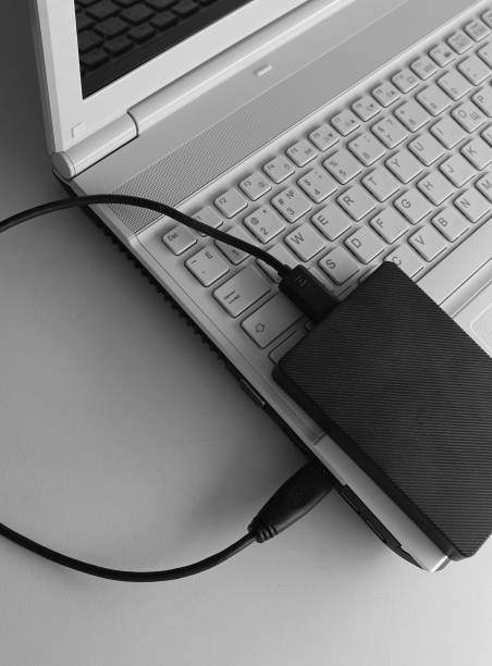 istock External Hard Drive Connected To White Laptop On Clean White Table 2178647260