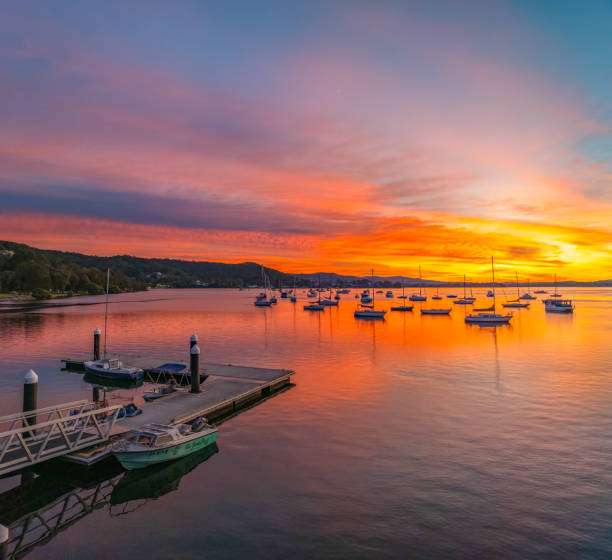 istock Aerial sunrise waterscape with boats and high cloud 2178648488