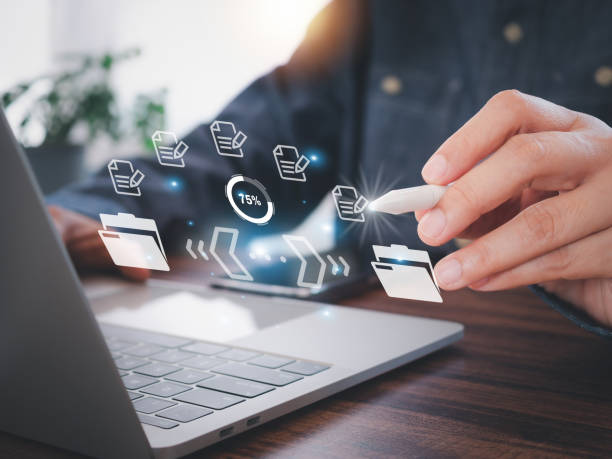 istock Company employees use stylus pens to write documents and send by internet. Sending file transfer, backup, and download document online. 2178650673
