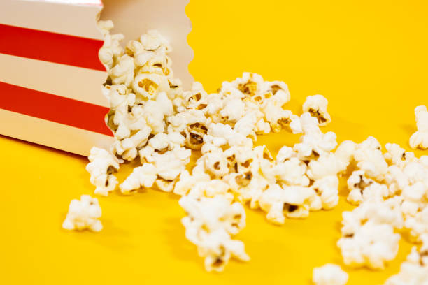 istock fallen carton bucket with popcorn in foreground 2178651156
