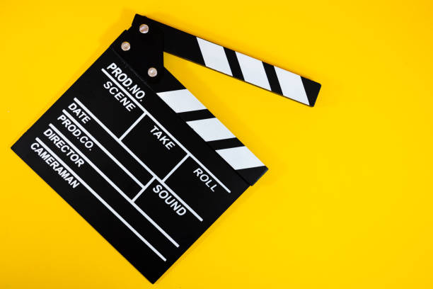 istock Film clapperboard on yellow background 2178651172