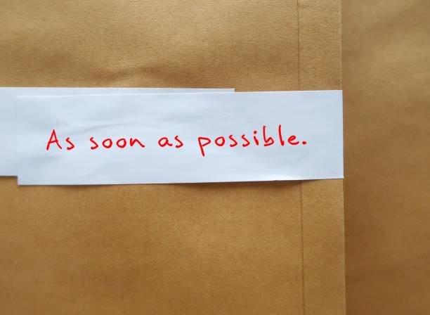 istock Office envelope written AS SOON AS POSSIBLE clip with a blue notebook, with a pencil. Concept of urging someone to do the work,edit,read,approve the project urgently 2178656170