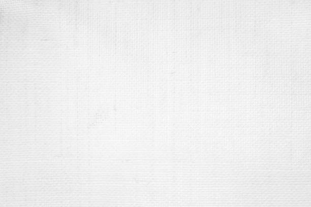 istock White color fabric canvas woven texture background in pattern light blank. Natural gauze linen, carpet wool and cotton cloth textile textured as clean empty for decoration text. Grey sack material. 2178656476