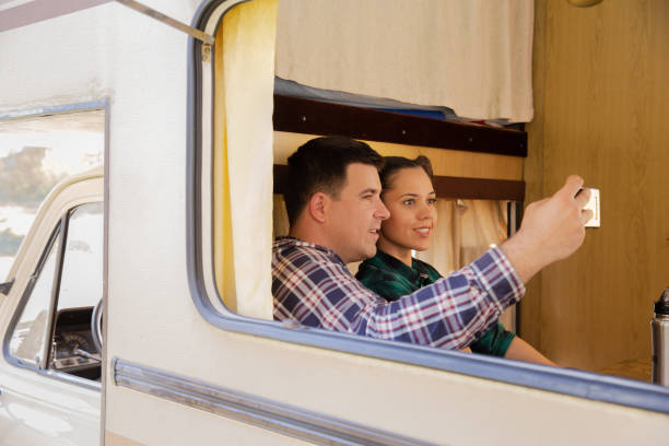 istock Beautiful young couple inside their retro camper van 2178656520