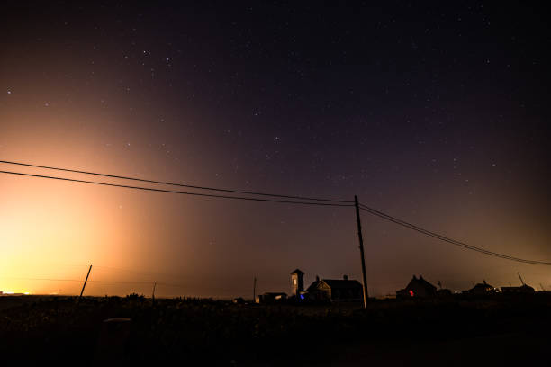 Power line next to power station at night Dungeness Kent England Europe