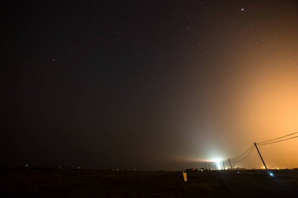 Power line next to power station at night Dungeness Kent England Europe