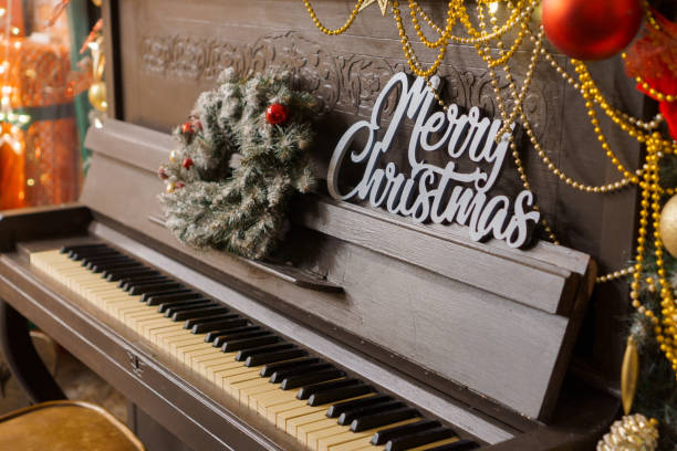 istock A decorated piano for Christmas with a tree in the background 2178657489