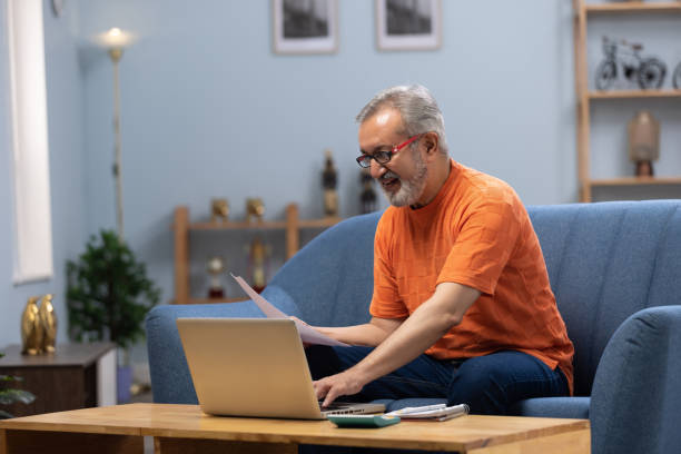 istock senior man using laptop at home stock photo 2178657748