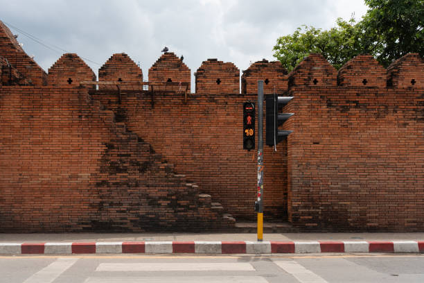 istock Ancient Tha Phae Gate situated beside the road with a crosswalk and traffic light for pedestrians. 2178657812