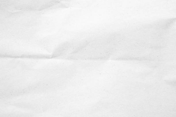 istock White recycled craft paper texture as background. Grey paper texture, Old vintage page or grunge vignette of old newspaper. Pattern rough art creased grunge letter. Hardboard with copy space for text. 2178659389