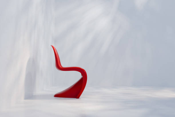 empty wooden chair on the concrete wall