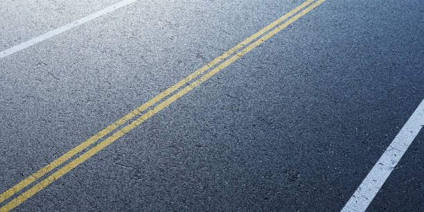 istock Empty road with white and yellow lane markings 2178660474