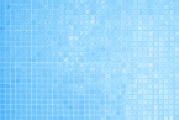 Blue light ceramic wall chequered and floor tiles mosaic background in bathroom. Design pattern geometric with grid wallpaper texture decoration pool. Simple seamless abstract surface clean.