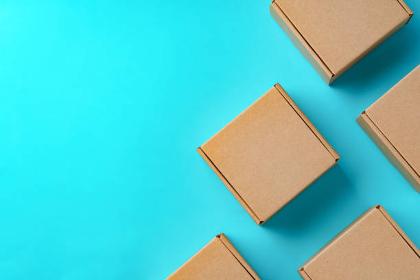 istock A collection of cardboard boxes arranged on a bright blue surface 2178661570