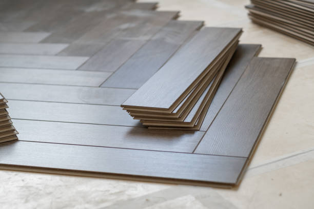 istock Worker installing laminate flooring in a residential apartment. Tools, planks 2178662107