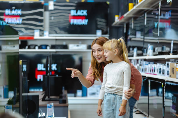 istock Mother and daughter shopping for electronics during Black Friday 2178663701