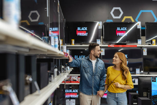 istock Happy couple shopping for electronics during Black Friday sale 2178663959