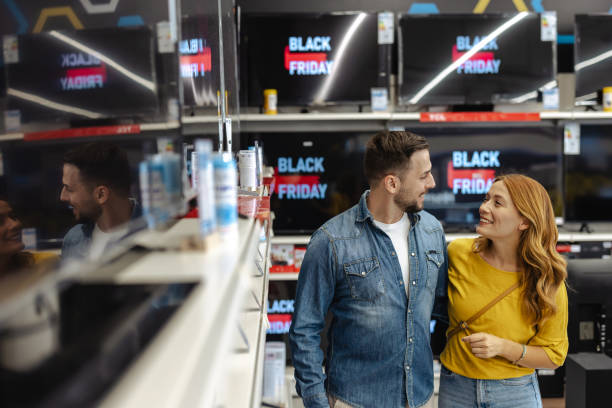 istock Happy couple shopping for electronics during Black Friday sale 2178663961