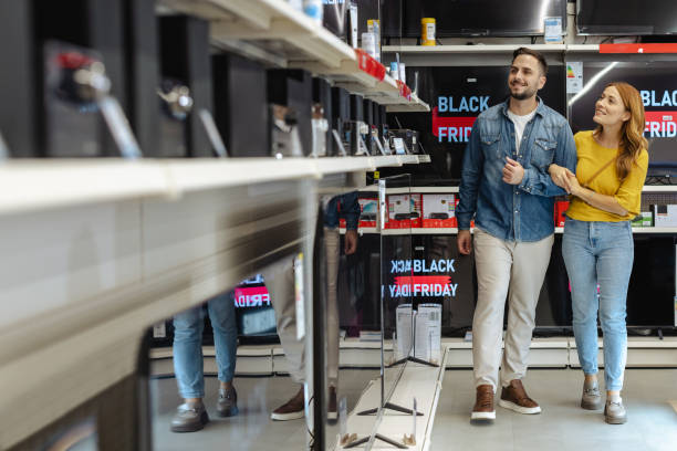 istock Happy couple shopping for electronics during Black Friday sale 2178663962