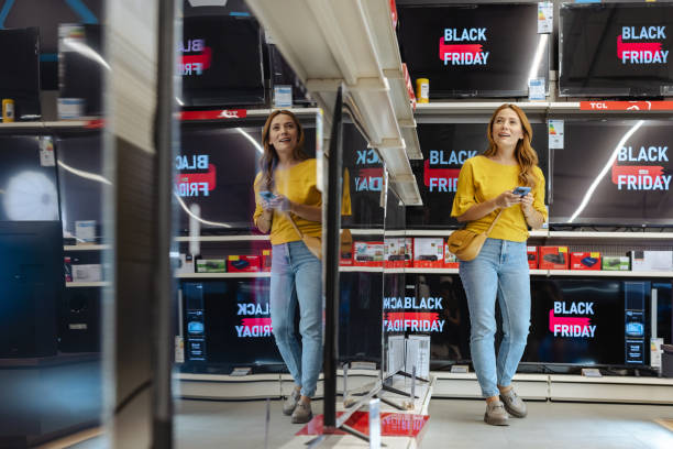 istock Young woman shopping on Black Friday in electronics store 2178664135