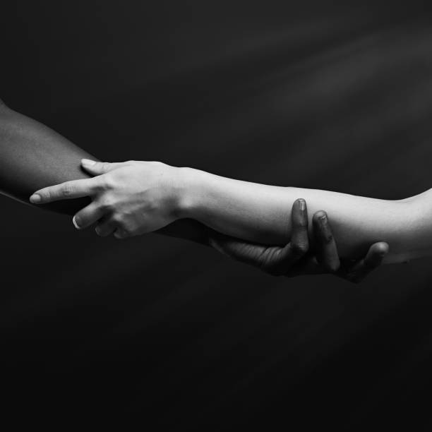 istock Two hands gripping each other. Human relations, unity, togetherness, symbolism concept 2178664730
