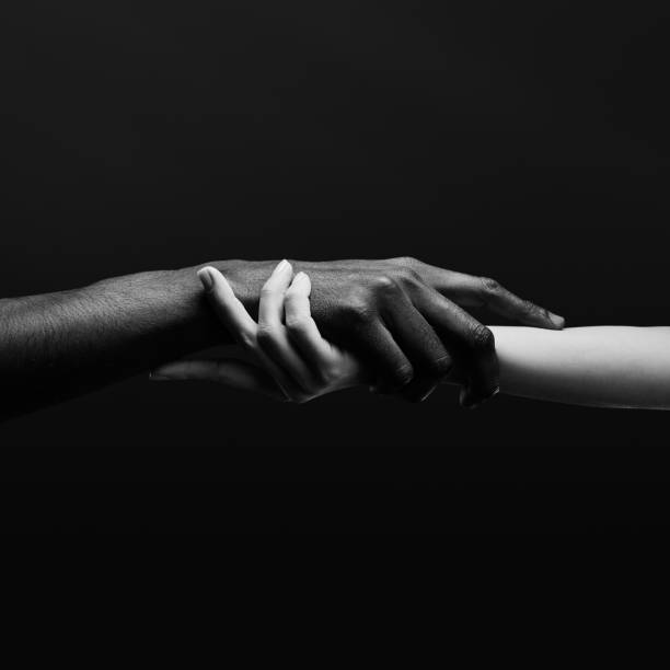 istock Two hands gripping each other. Human relations, unity, togetherness, symbolism concept 2178664935