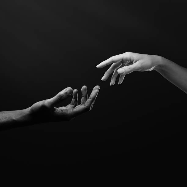 istock Two hands reaching for each other. Human relations, trust, unity, togetherness, symbolism concept 2178664969