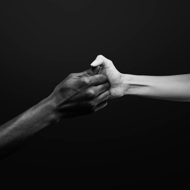 istock Two hands gripping for each other and play thumb wrestling. Human relations, power, unity, togetherness, symbolism concept 2178665011