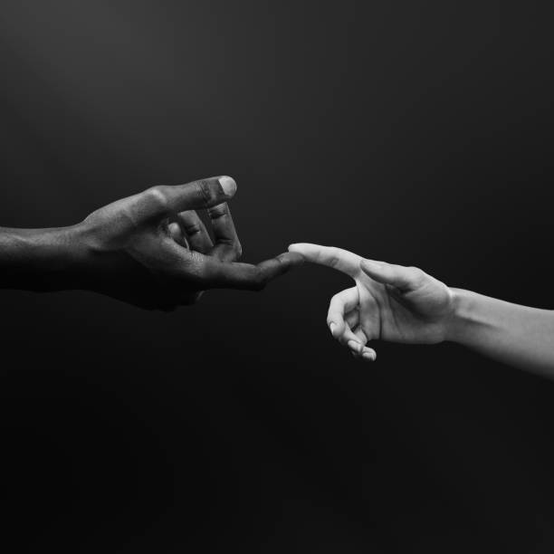 istock Two hands reaching for each other. Human relations, unity, togetherness, symbolism concept 2178665176