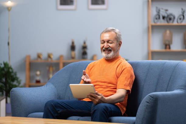 istock Senior man using digital tablet at home stock photo 2178665218