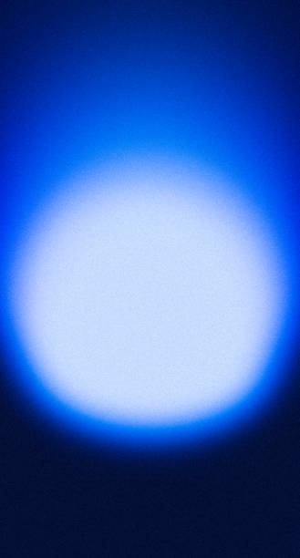 istock Grainy blurry glowing dark blue aura spotlight gradient black vertical background with blank space 2178665454