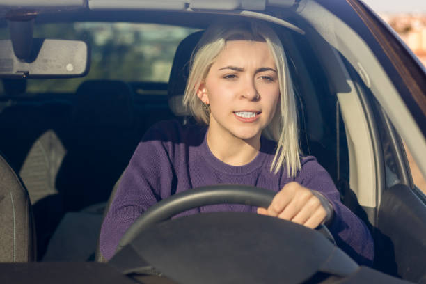 istock Focused driver in purple sweater 2178666666