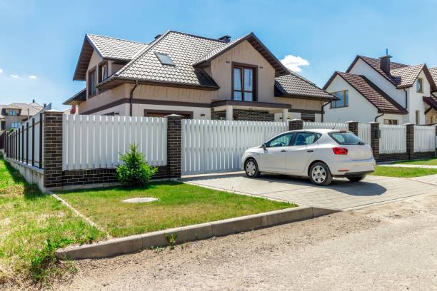 istock Modern Suburban Home with Car Parked in the Driveway 2178666829