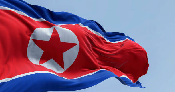 istock North Korea national flag waving in the wind on a clear day 2178666876