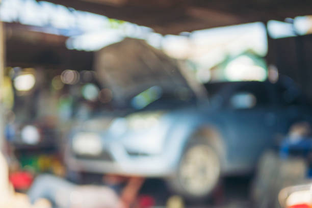 Blur background Mechanic tools engineering equipment car auto repair shop. Blurred background mechanical service. Defocused soft effect vehicle station industrial blurry car garage with copy space