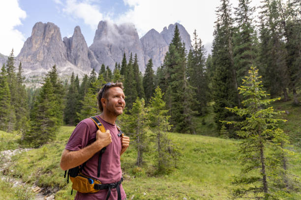istock Smiling Male Hiker Enjoying Mountain Scenery 2178670311