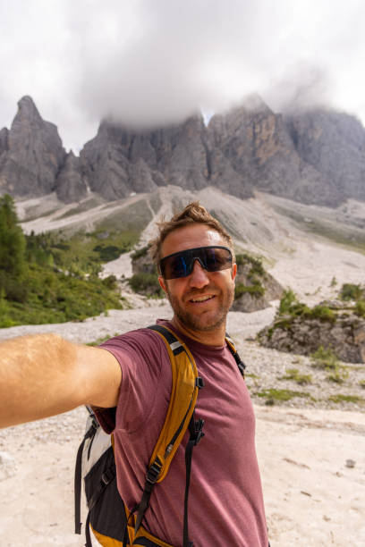 istock Smiling Hiker Taking a Selfie in the Mountains 2178671184