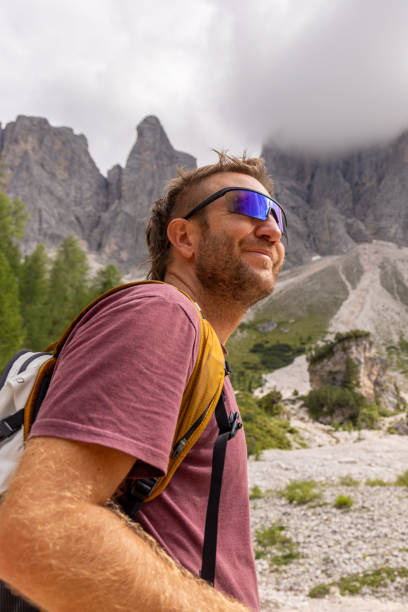 istock Hiker Admiring Mountain Peaks on a Sunny Day 2178671237
