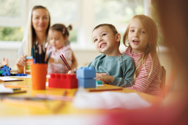 istock Children having fun drawing in kindergarten 2178671443