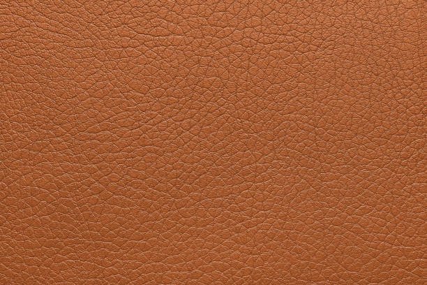 istock Natural, genuine orange leather texture, structure of glossy leatherette macro background 2178673389