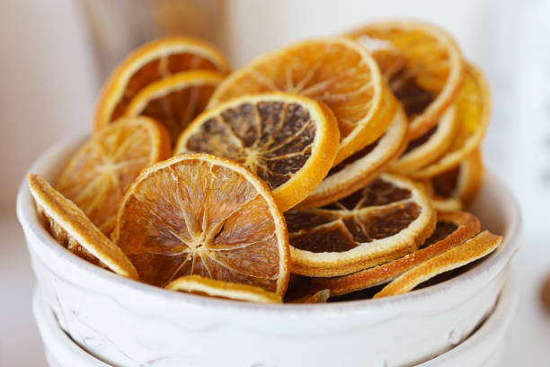 istock Dried orange slices neatly arranged in a decorative bowl on a bright kitchen counter 2178673405