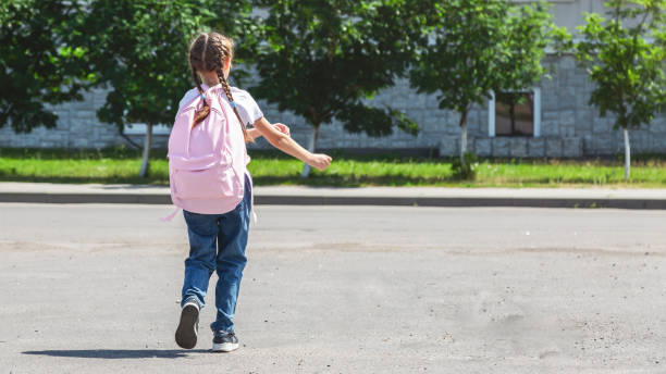 istock Back to school. cute child girl with backpack going to school 2178673865