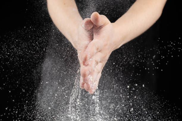 istock Splash of wheat flour, cook working with dough, hands close-up. 2178675554