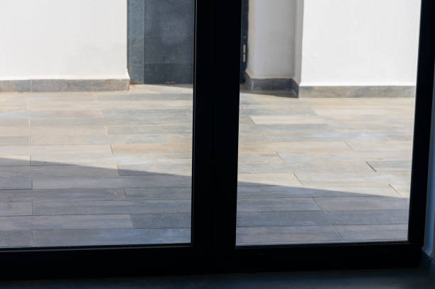 istock Sunlight Streaming Through Glass Doors Onto a Beautifully Tiled Patio During a Calm Afternoon 2178676261