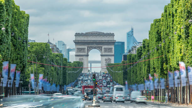 istock Arc de Triomphe viewed up the Champs Elysees with traffic timelapse. Paris, France 2178676728