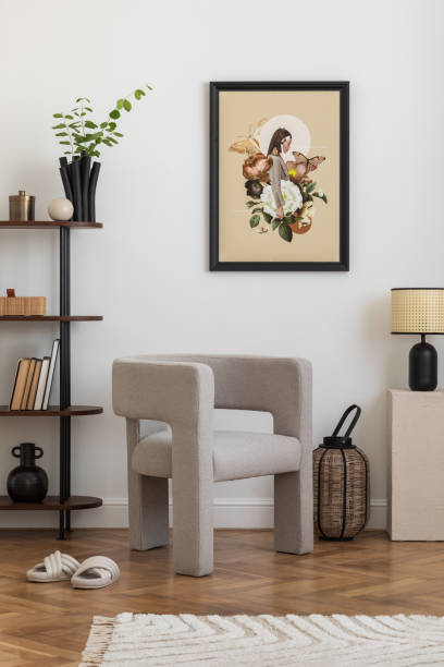 istock Interior design of white living room space with modern armchair, mock up poster frame, commode,  books, plants and personal accessories. Template. Home decor. 2178678149