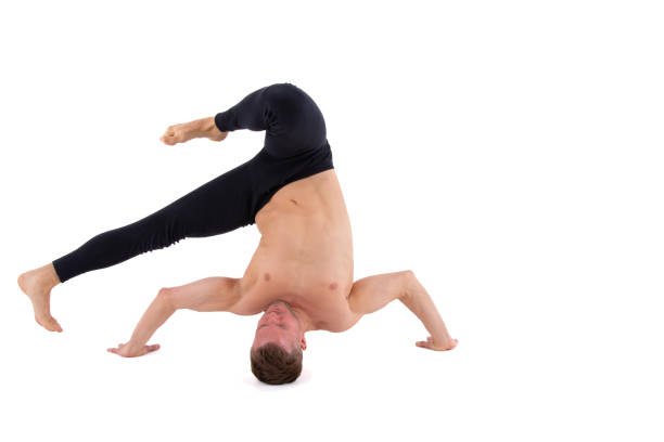 A dancer warming up by performing stretching exercises.