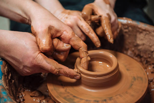 istock Potter teach pupil on circle wheel in workshop. Hands Close up 2178678792