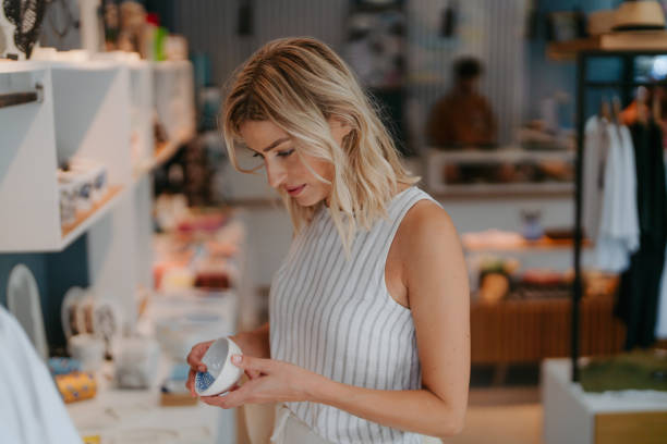 istock Beautiful Woman Selecting Souvenirs 2178678971
