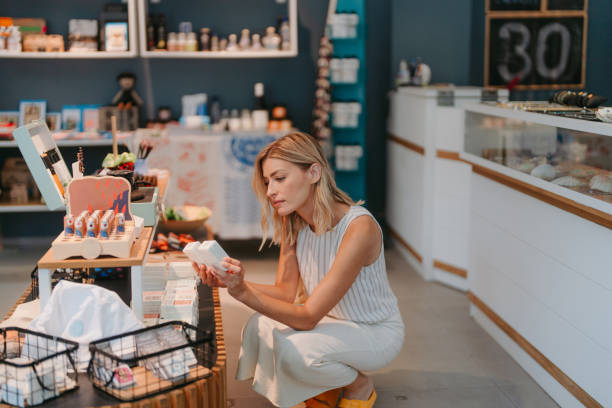 istock Beautiful Woman Selecting Souvenirs 2178678984
